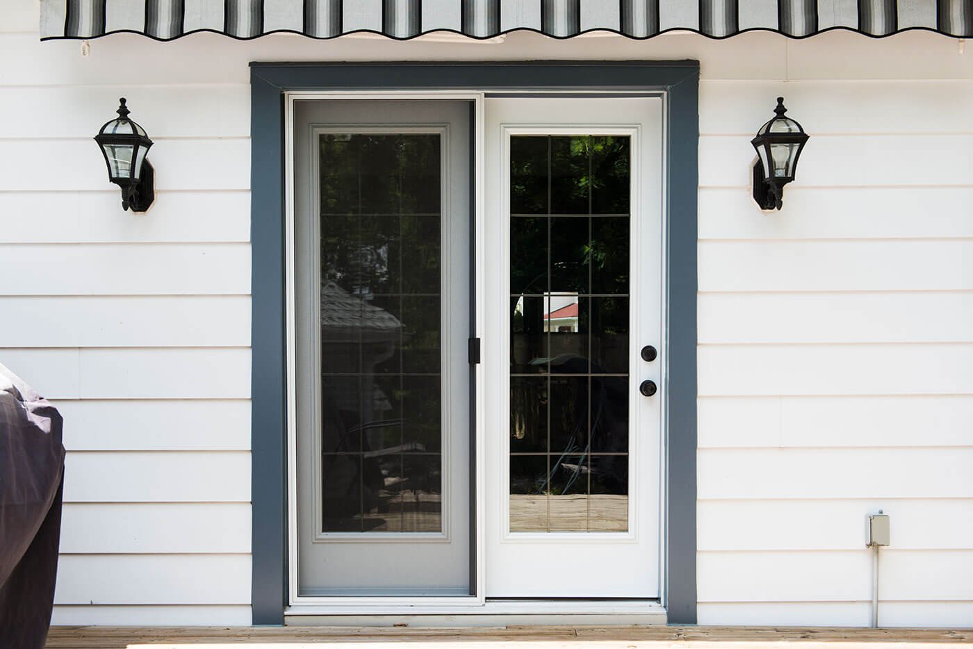 Custom Made White Garden Doors For Smaller Home With White Vinyl Siding